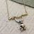 Quirky Sterling Silver Jewellery: Cheeky Monkey swinging from a Branch Pendant in Silver and Gold (24mm x 19mm) (N146)