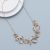 Contemporary Gold Tone Necklace with Twisted Links with Pink and Grey Accents (M628)
