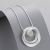 Gracee Fashion: Contrasting Shiny and Matt Silver Tone Curling Ribbon and Circle Pendant (GR207)