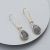 Long Gold Tone Hooked Earrings with Iridescent Grey Teardrops