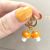Gold Tone Huggy Hoops with Orange Murano Glass Mushroom Charms (M674)B)