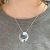 Gorgeous Curling Wave Pendant with Shimmery Blue Accents (M135)